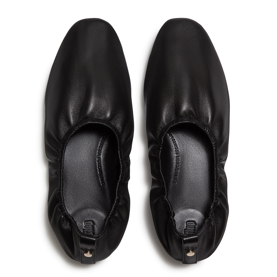 Leather ballet flats with a ruched cuff, round toe and hidden comfort cushioning.