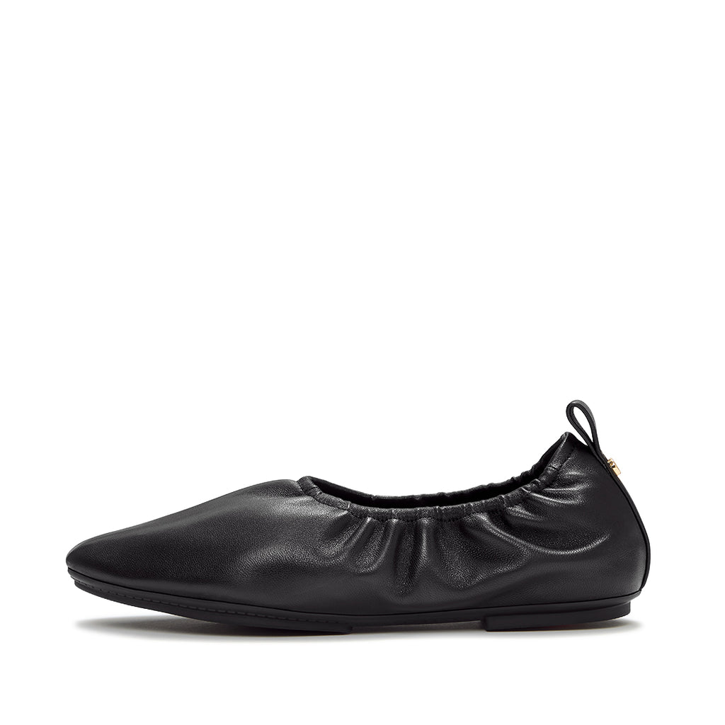 Leather ballet flats with a ruched cuff, round toe and hidden comfort cushioning.