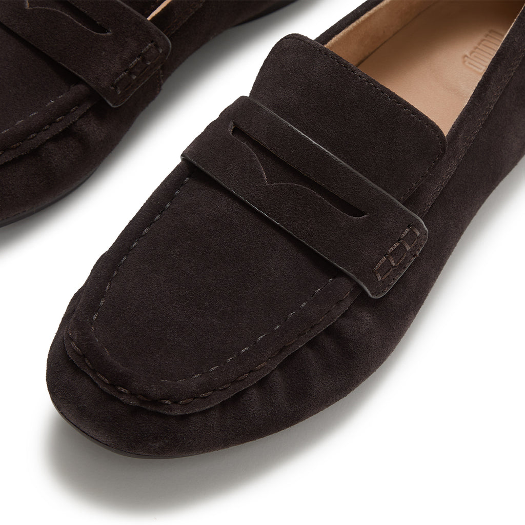 Close-up of FitFlop DELICATO Suede Loafers showcasing the premium suede texture, classic penny strap, and refined craftsmanship.