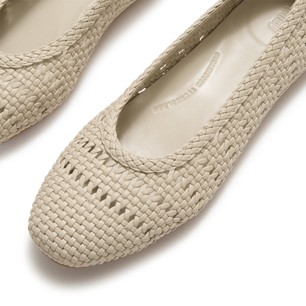 Close-up of FitFlop DELICATO Woven PU Ballerinas showcasing the woven faux-leather texture and refined craftsmanship.