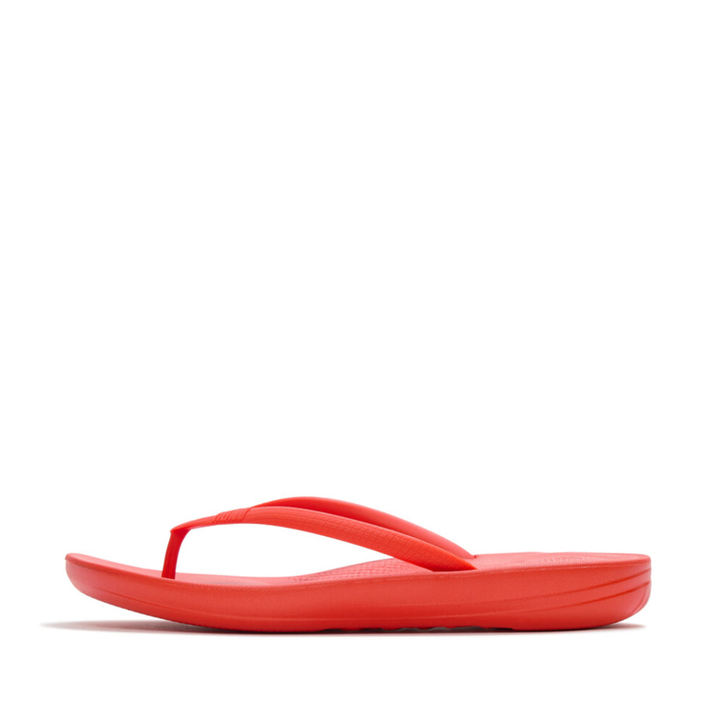 Ergonomic FitFlop iQushion flip-flops with impact-absorbing cushioning, contoured support, and slip-resistant grip, designed for all-day comfort. APMA-approved.