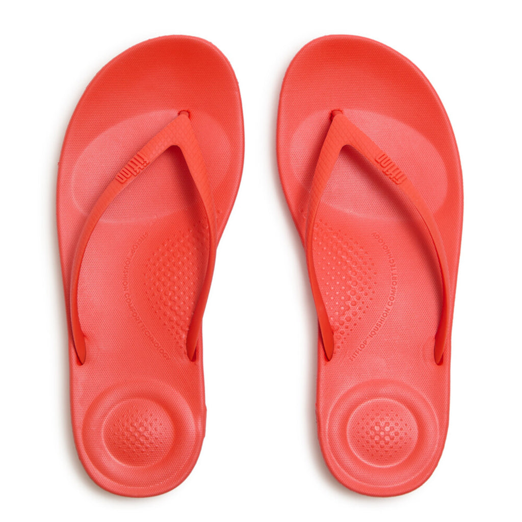 Ergonomic FitFlop iQushion flip-flops with impact-absorbing cushioning, contoured support, and slip-resistant grip, designed for all-day comfort. APMA-approved.