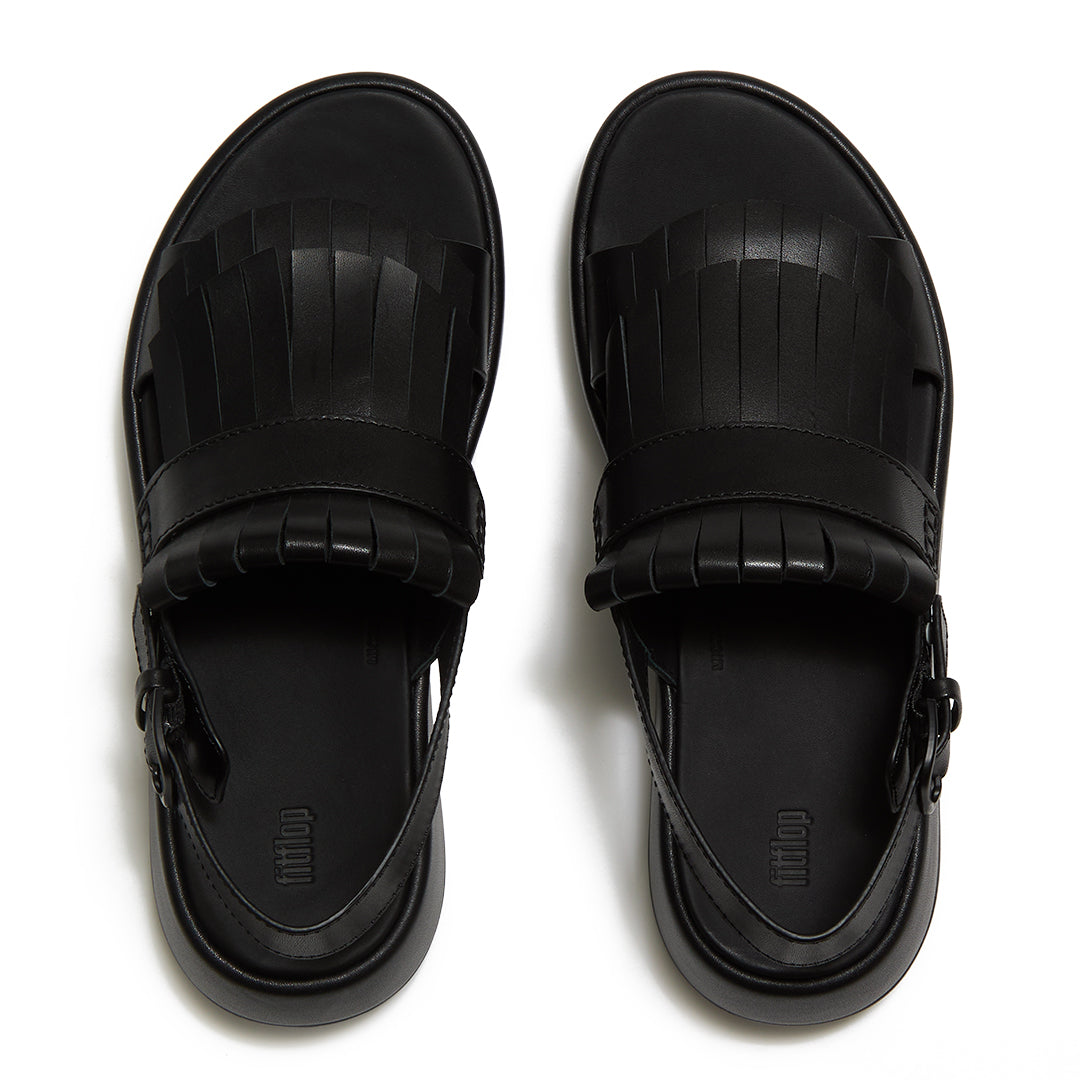 Top view of FitFlop F-MODE Fringe Sandals highlighting premium leather straps, decorative fringe trim, toe-post design, and adjustable ankle buckle.