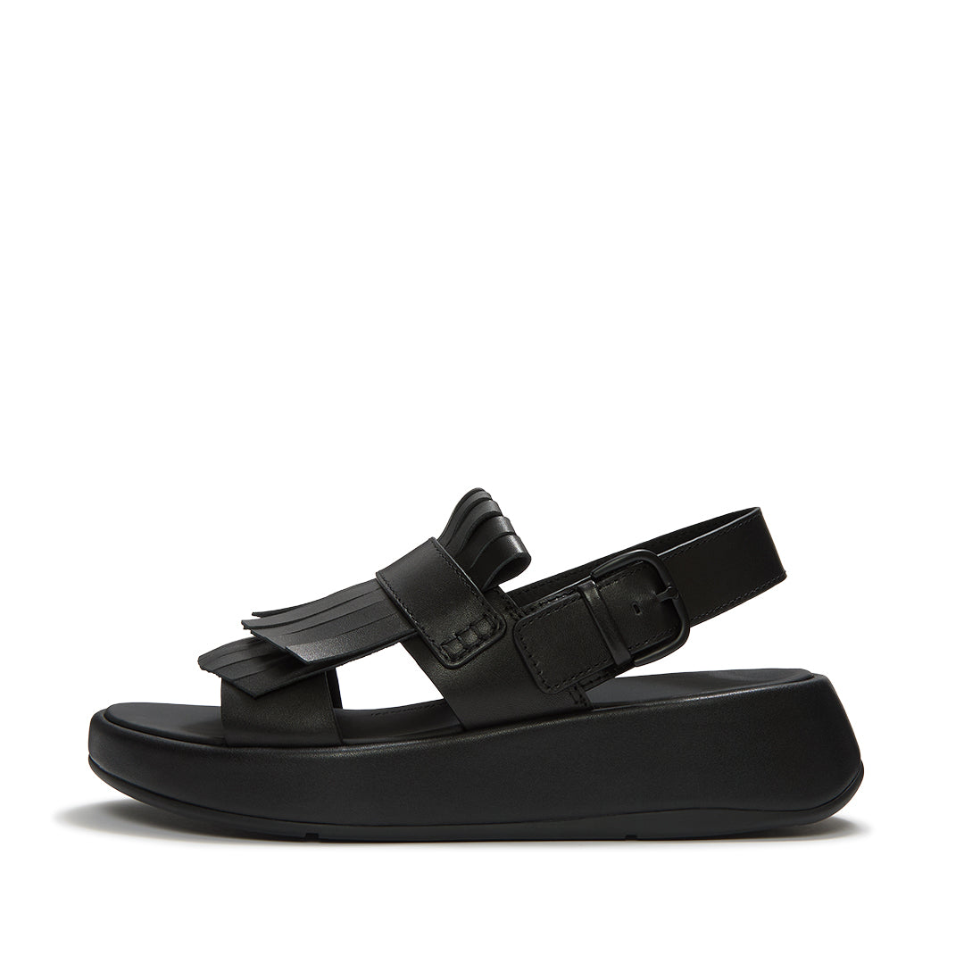 FitFlop F-MODE Fringe Sandals featuring premium leather straps, loafer-inspired fringe detailing, adjustable ankle buckle, and a chunky cushioned sole.