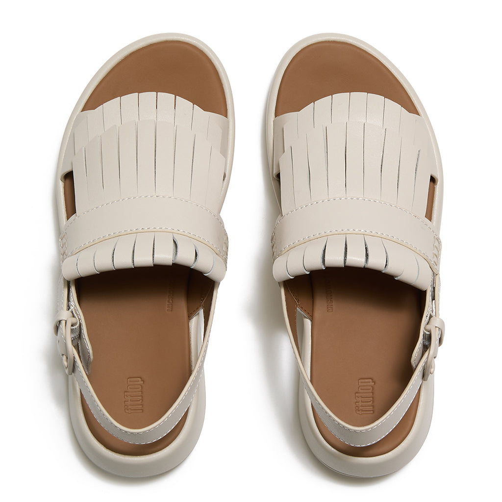 Top view of FitFlop F-MODE Fringe Sandals highlighting premium leather straps, decorative fringe trim, toe-post design, and adjustable ankle buckle.