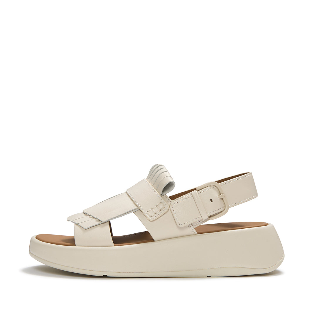 FitFlop F-MODE Fringe Sandals featuring premium leather straps, loafer-inspired fringe detailing, adjustable ankle buckle, and a chunky cushioned sole.