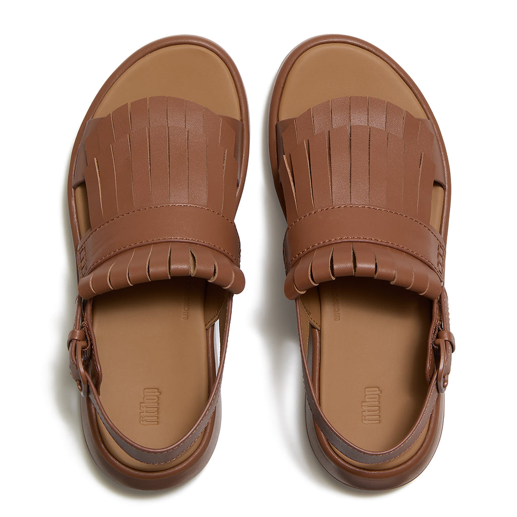 Top view of FitFlop F-MODE Fringe Sandals highlighting premium leather straps, decorative fringe trim, toe-post design, and adjustable ankle buckle.