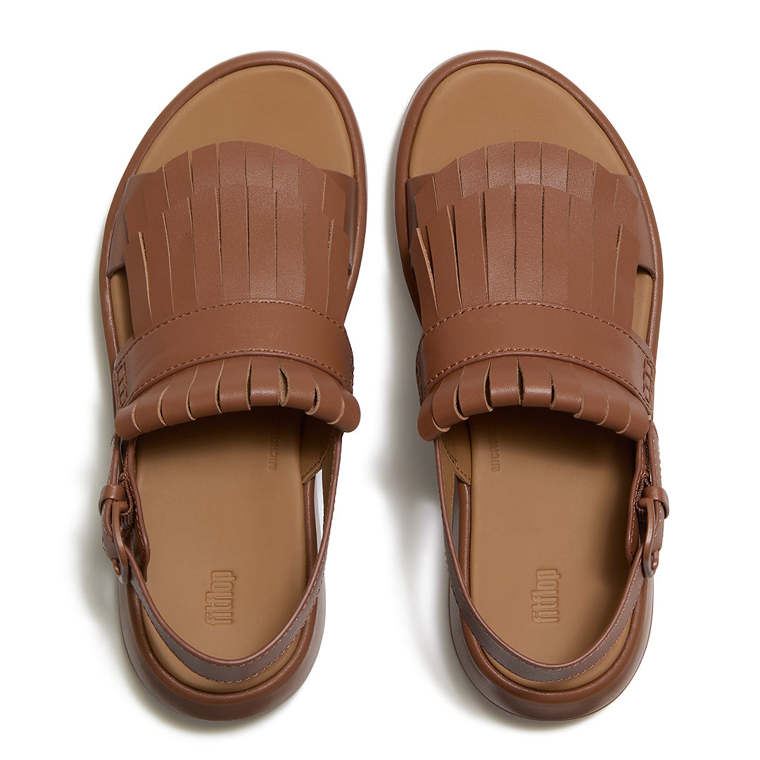 Top view of FitFlop F-MODE Fringe Sandals highlighting premium leather straps, decorative fringe trim, toe-post design, and adjustable ankle buckle.