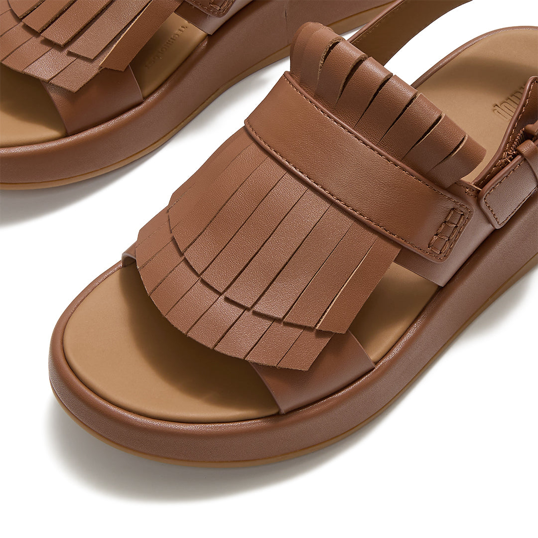 Front view of FitFlop F-MODE Fringe Sandals featuring classic loafer-inspired fringe detailing, leather straps, and an open-toe silhouette.