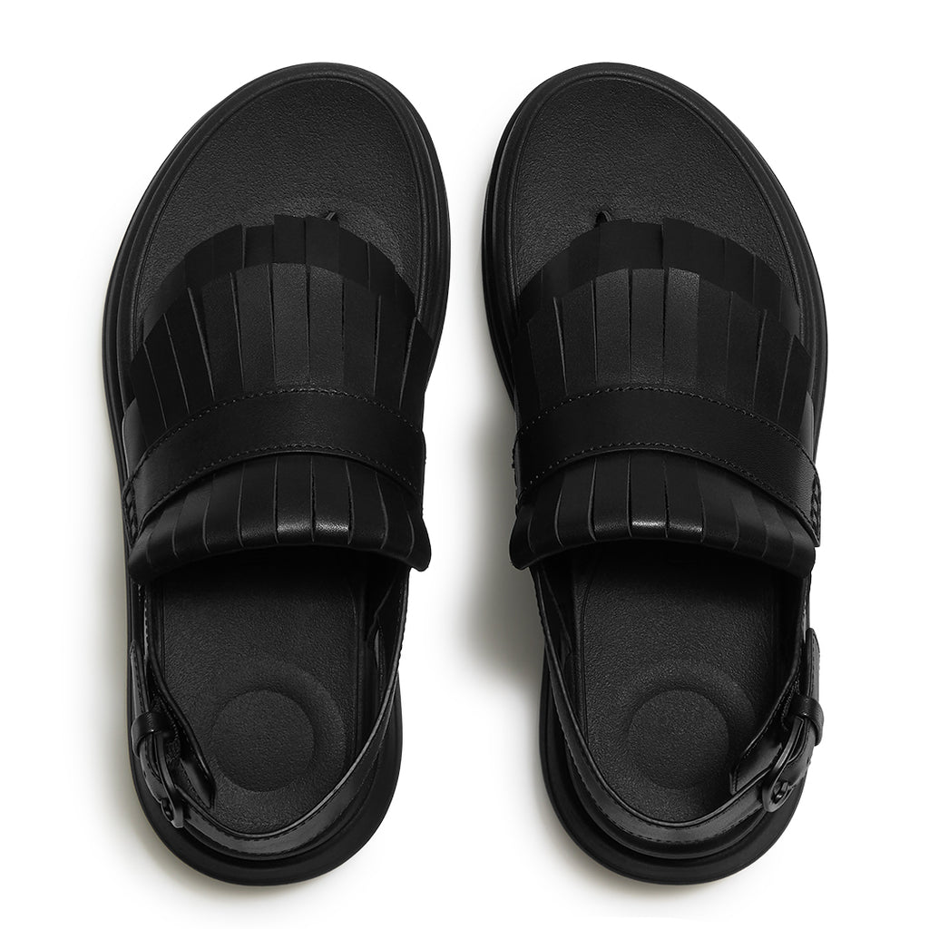 Top view of FitFlop F-MODE STACK Leather Fringe Sandals highlighting the tassel-inspired trim, toe-post design, and adjustable ankle strap.