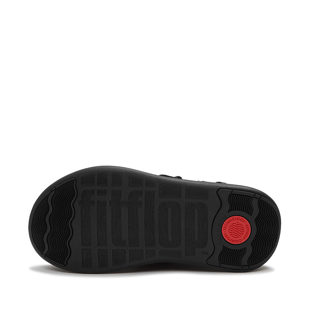 FitFlop F-MODE STACK Leather Fringe Toe-Post Sandals featuring a stacked platform sole and pressure-diffusing Microwobbleboard™ comfort technology.