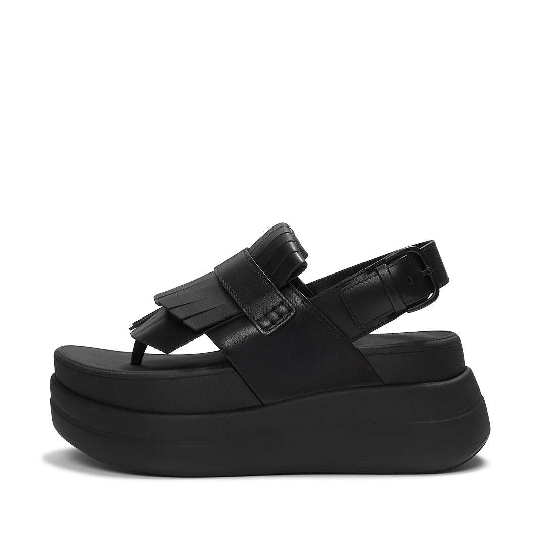 FitFlop F-MODE STACK Leather Fringe Toe-Post Sandals featuring premium leather straps, loafer-inspired fringe detailing, and a platform sole.