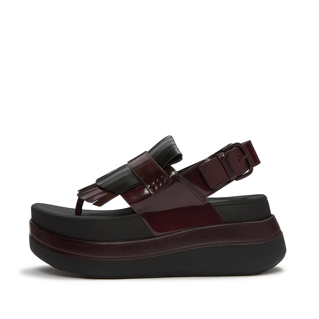 FitFlop F-MODE STACK Leather Fringe Toe-Post Sandals featuring premium leather straps, loafer-inspired fringe detailing, and a platform sole.