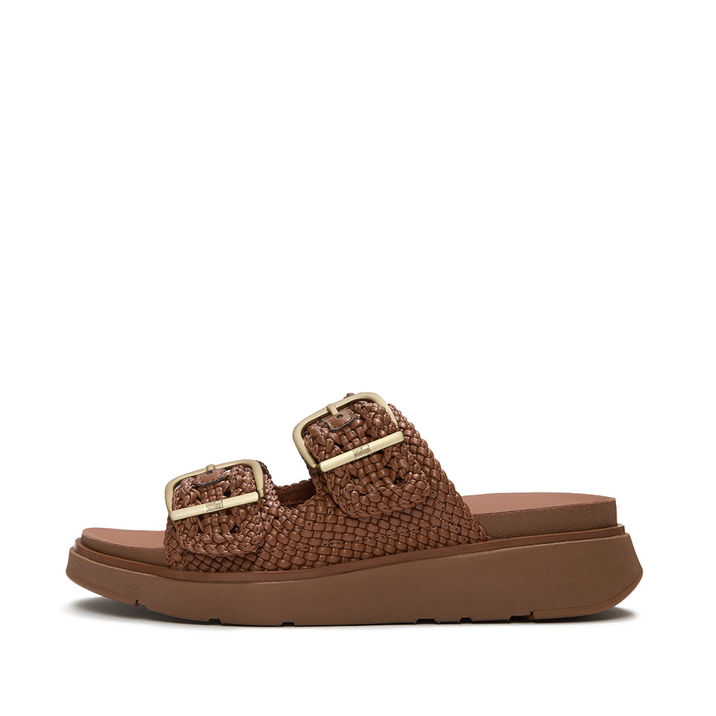 FitFlop GEN-FF Woven Two-Bar Slides featuring woven faux-leather, two adjustable buckle straps and a cushioned Microwobbleboard™ sole.