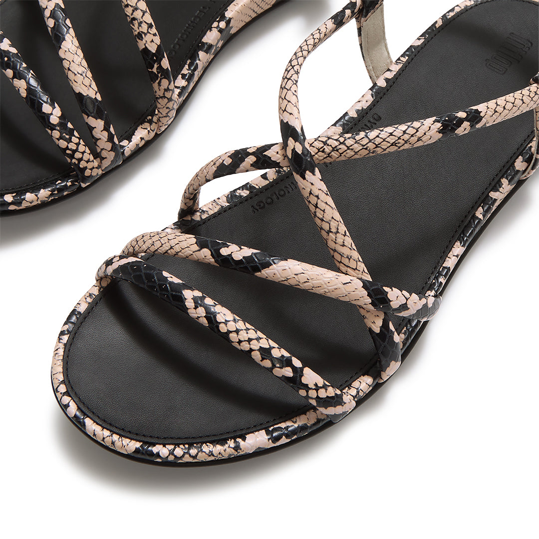 Close-up of FitFlop GRACIE Snake Sandals showcasing the textured snake-print leather and criss-cross strap detailing.