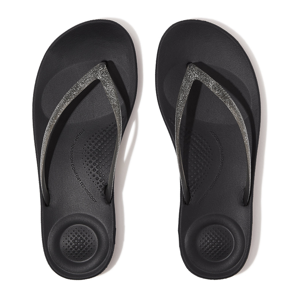 FitFlop iQUSHION Glitter Flip-Flops featuring an anatomically contoured footbed with natural arch support and pressure-diffusing comfort.