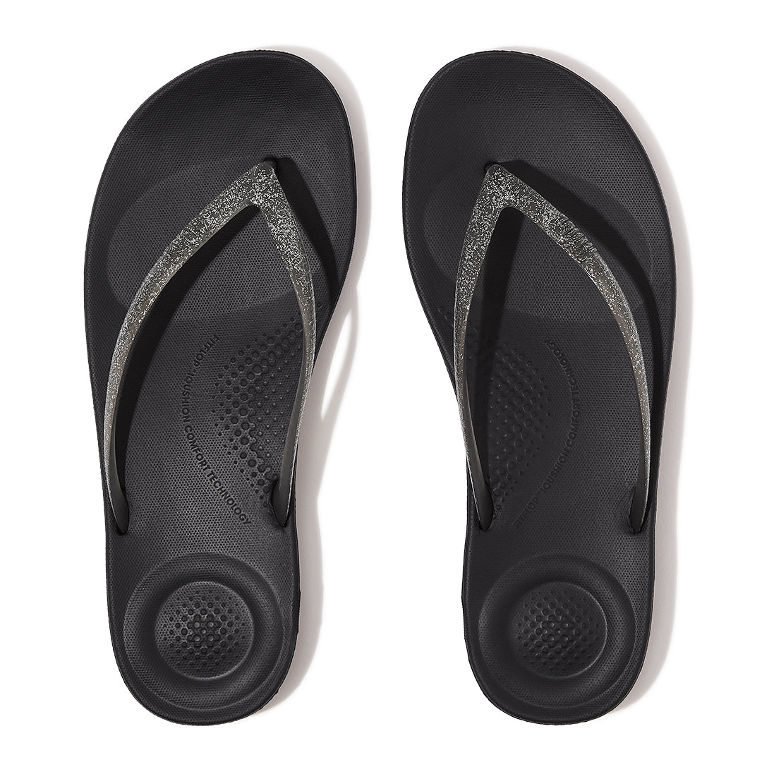 FitFlop iQUSHION Glitter Flip-Flops featuring an anatomically contoured footbed with natural arch support and pressure-diffusing comfort.