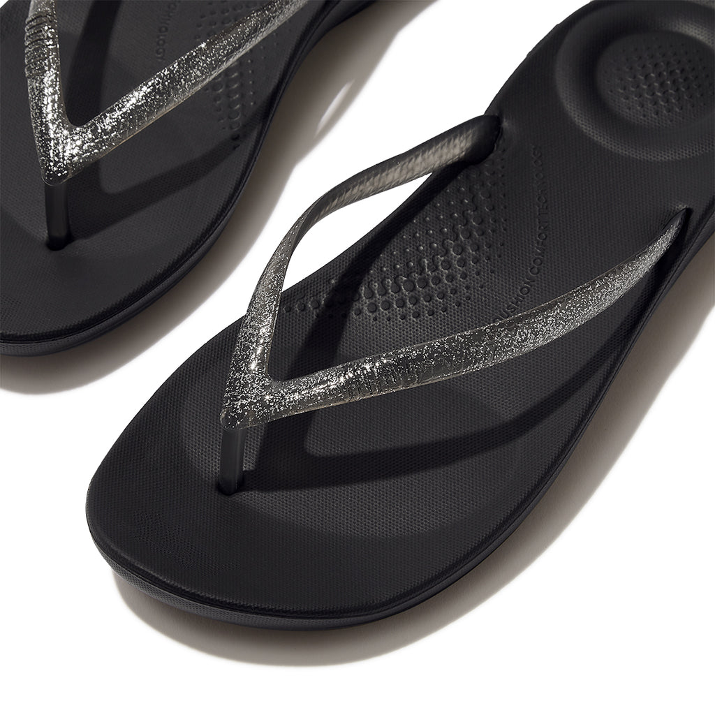 Close-up of FitFlop iQUSHION Glitter Flip-Flops highlighting glitter strap detailing and anatomically shaped construction.