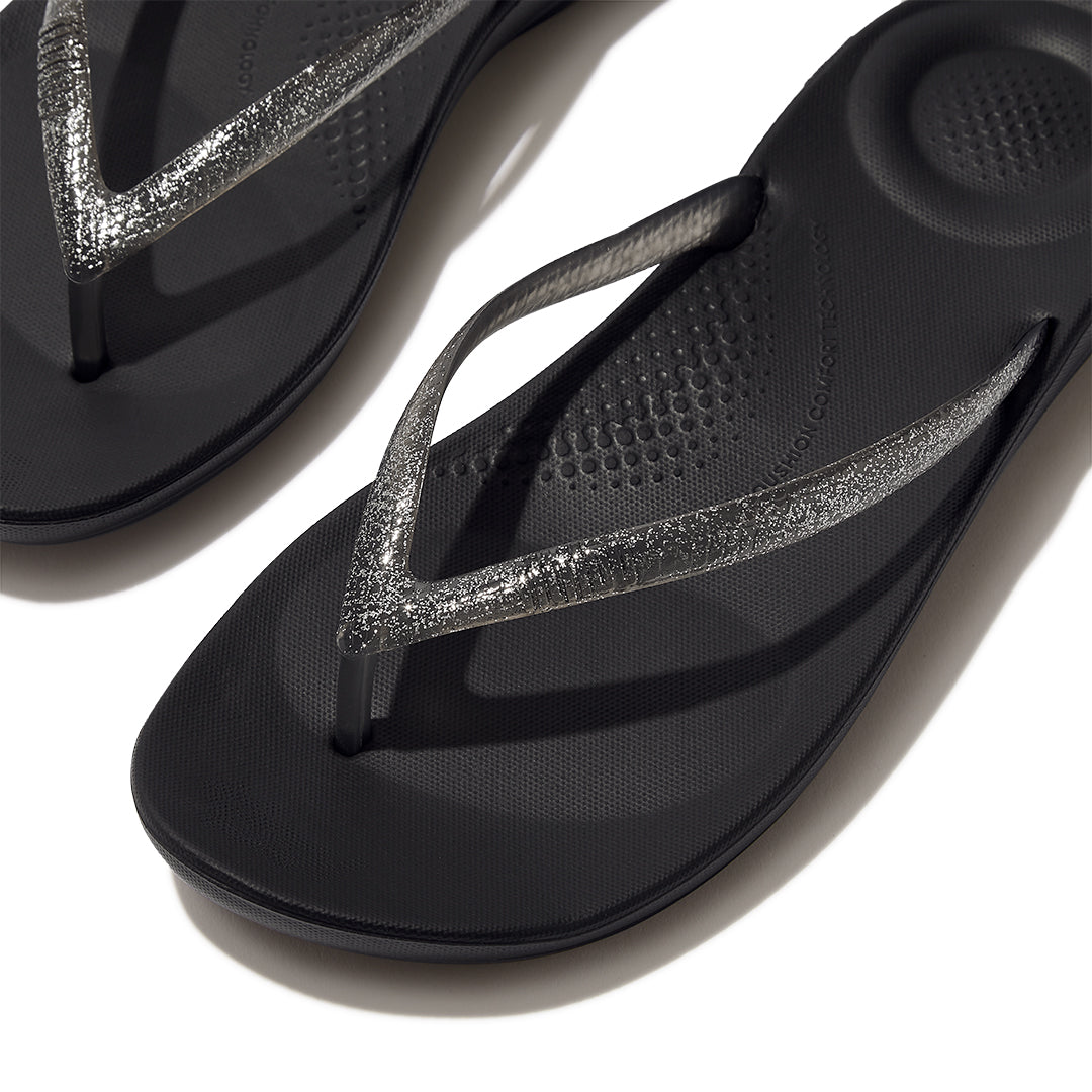 Close-up of FitFlop iQUSHION Glitter Flip-Flops highlighting glitter strap detailing and anatomically shaped construction.