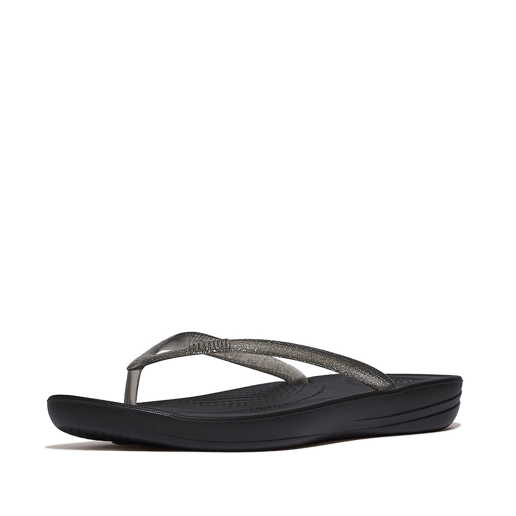 FitFlop iQUSHION Glitter Ergonomic Flip-Flops with sparkling straps, waterproof construction, ergonomic footbed, and lightweight cushioned sole.