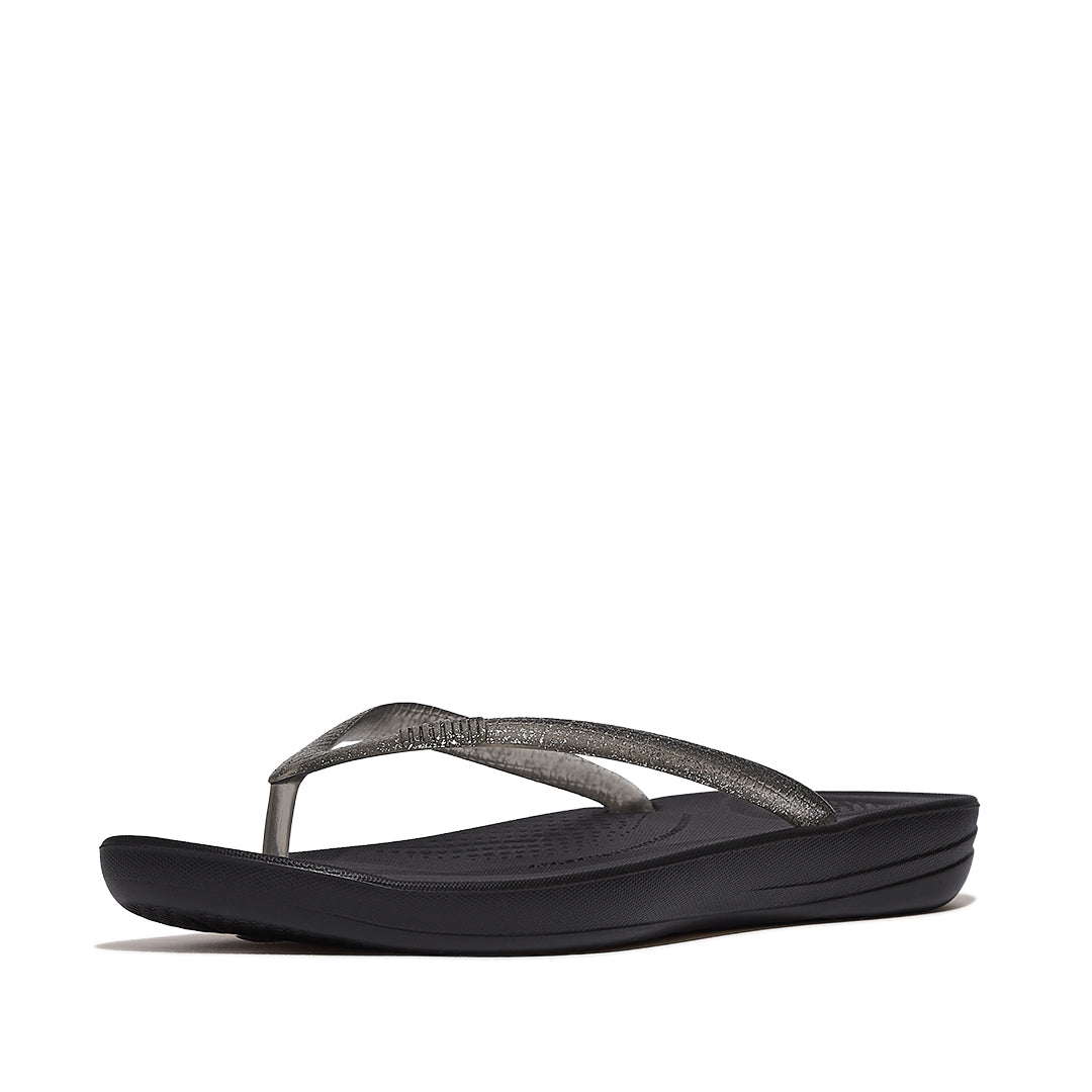 FitFlop iQUSHION Glitter Ergonomic Flip-Flops with sparkling straps, waterproof construction, ergonomic footbed, and lightweight cushioned sole.