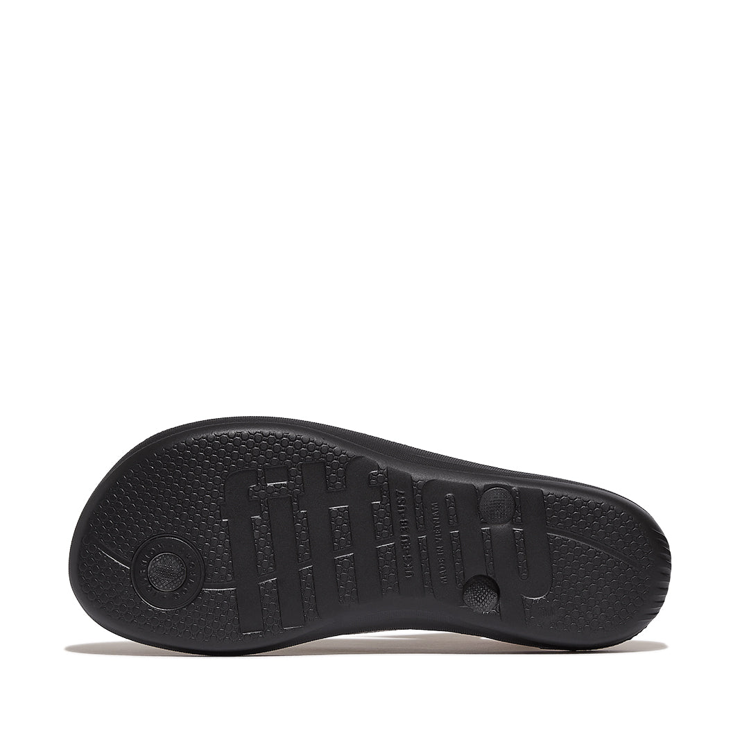 FitFlop iQUSHION Glitter Flip-Flops with ultra-light iQushion™ midsole, impact pillows, and high-rebound cushioning technology.