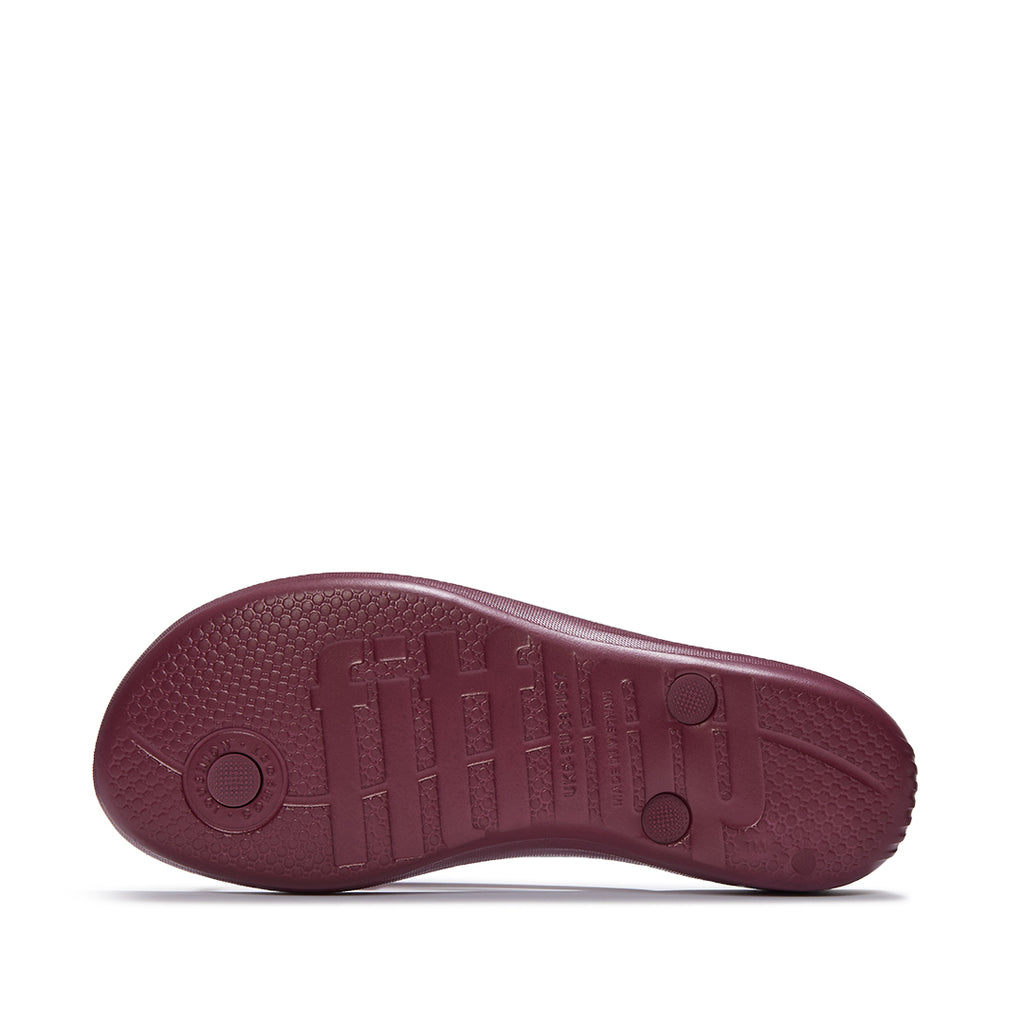 FitFlop iQUSHION Glitter Flip-Flops with ultra-light iQushion™ midsole, impact pillows, and high-rebound cushioning technology.