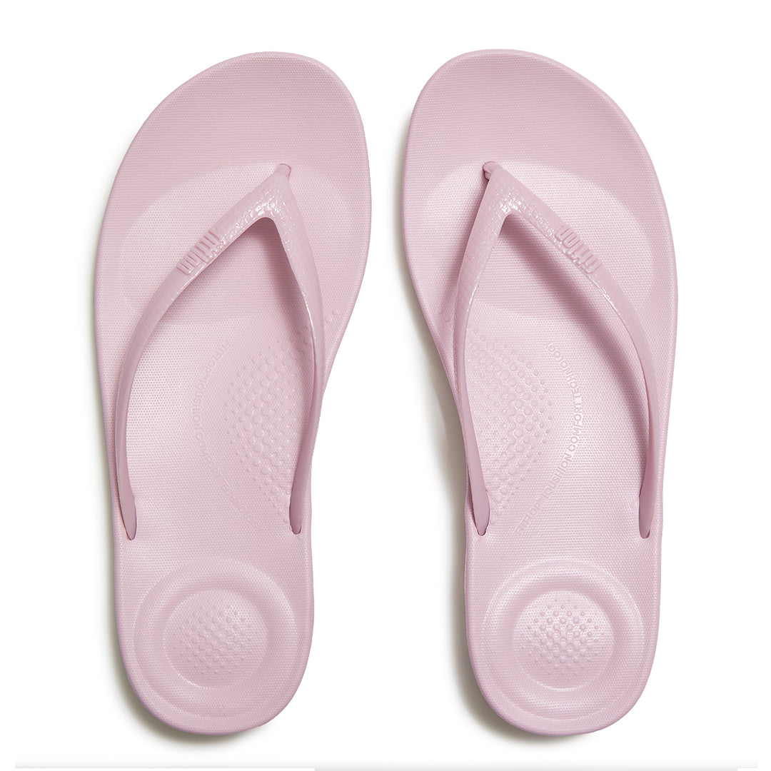 FitFlop iQUSHION Glitter Flip-Flops featuring an anatomically contoured footbed with natural arch support and pressure-diffusing comfort.