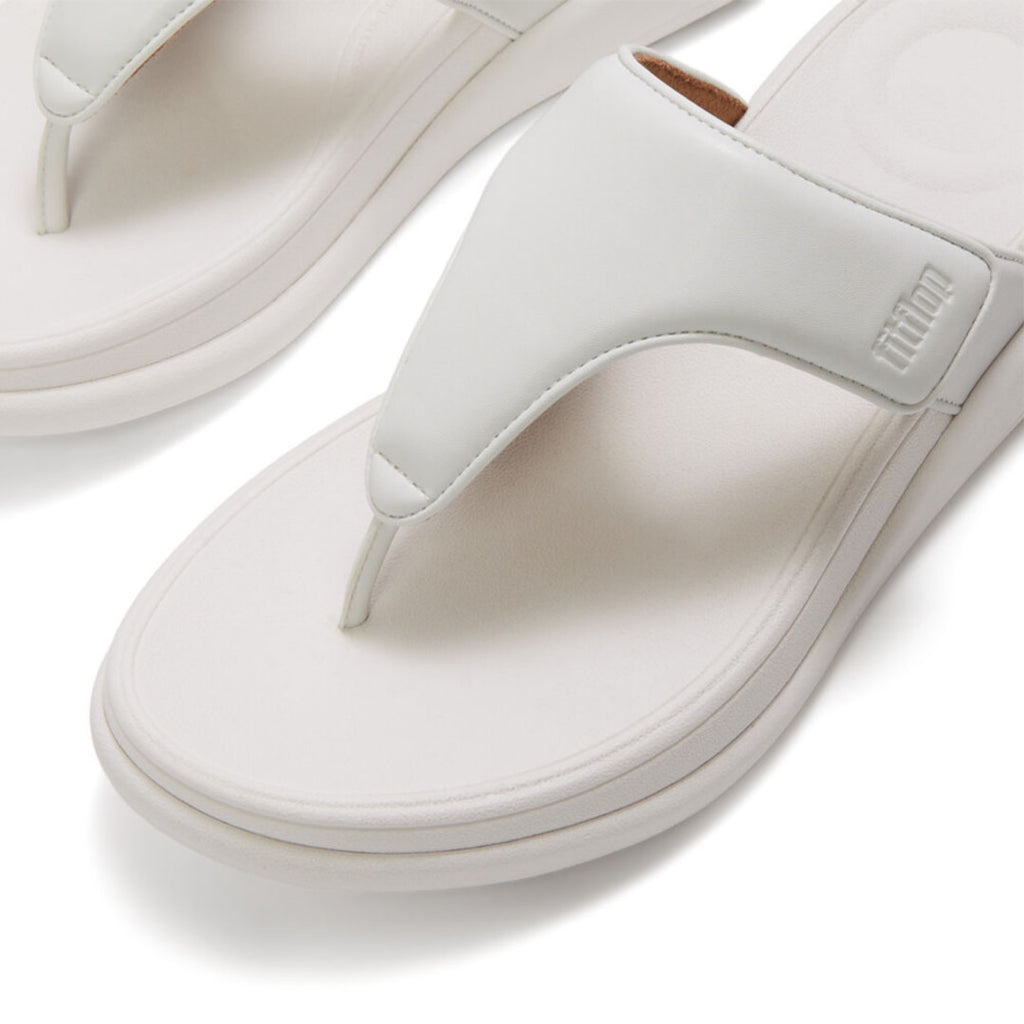 Close-up of FitFlop F-MODE Go Adjustable Toe-Post Sandals featuring metallic faux-leather straps and soft padded detailing.