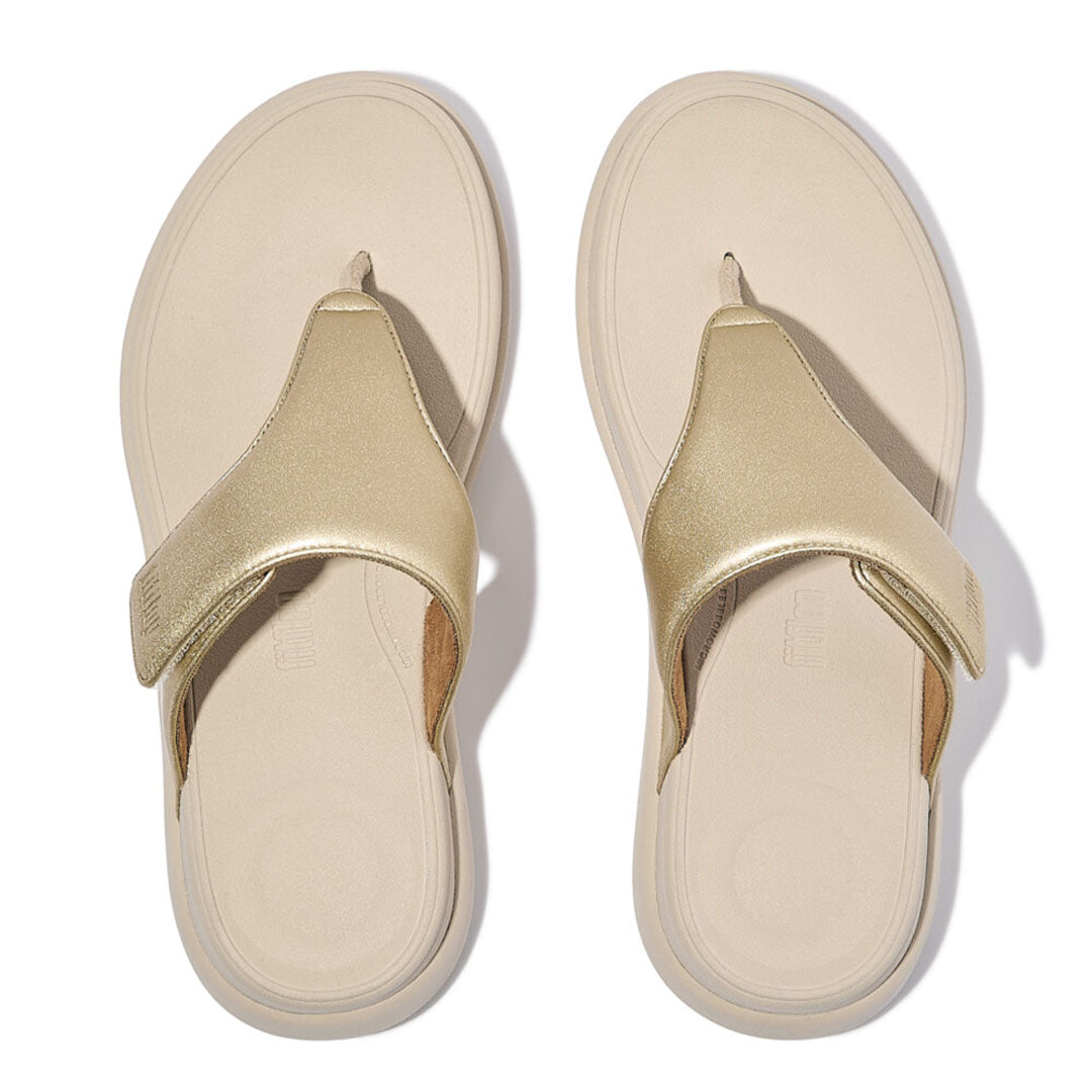 Top view of FitFlop F-MODE Go Toe-Post Sandals highlighting the adjustable touch-fastening strap, toe-post design, and contoured footbed.