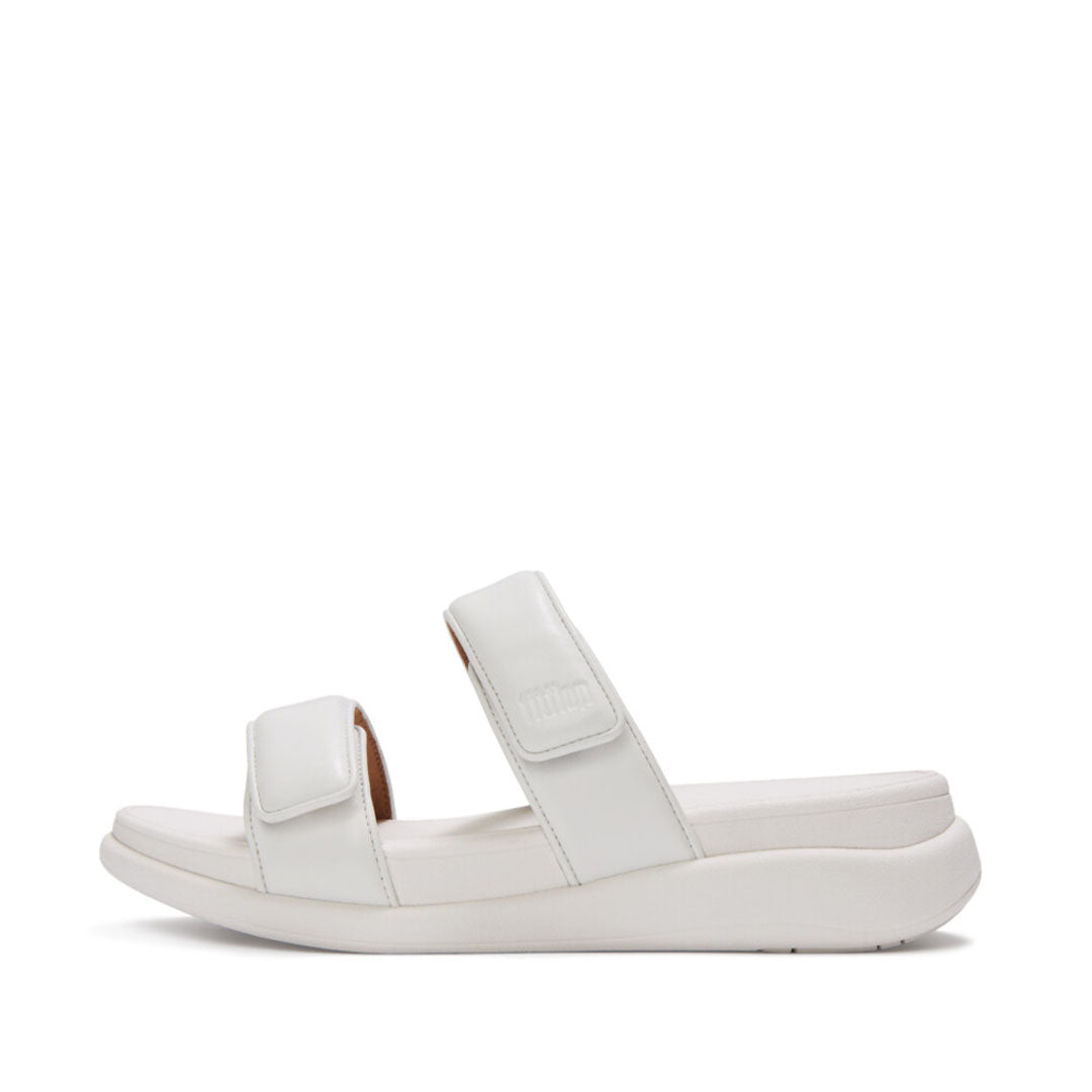 FitFlop F-MODE Go Adjustable Flatform Two-Bar Slides featuring metallic padded straps, adjustable touch fastenings, and a chunky flatform sole.