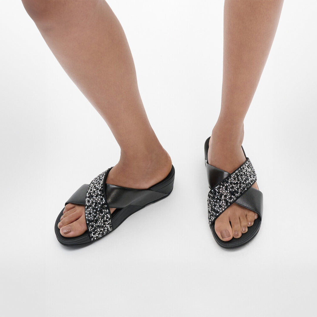 LULU crystal-mix metallic cross slides with padded straps, sparkling crystals, and Microwobbleboard™ cushioned footbed.