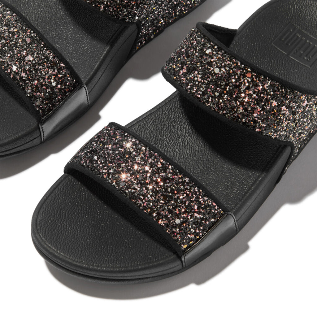 LULU multi-tonal glitter slides with padded straps and Microwobbleboard™ cushioned footbed, metallic side panels, and tonal piping.