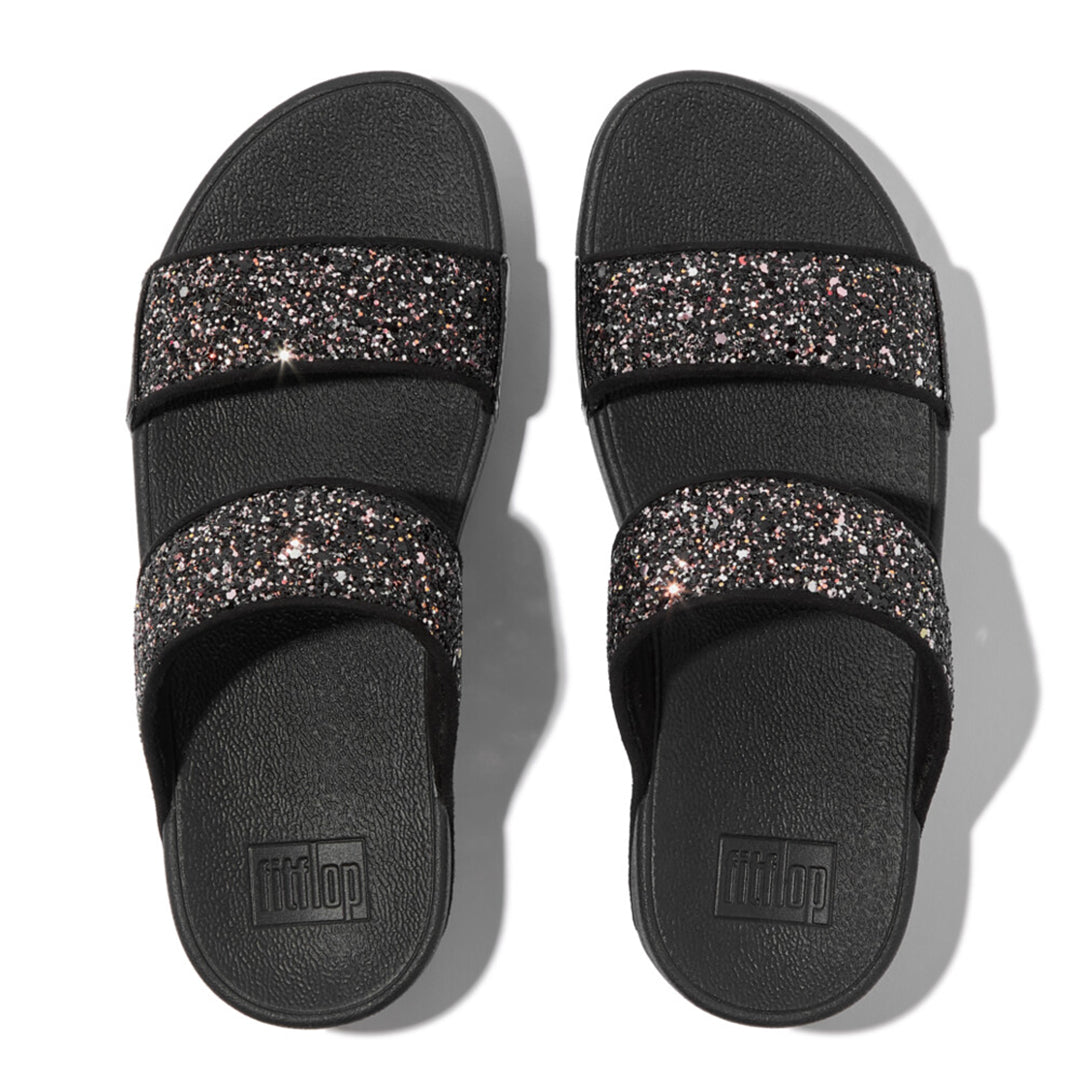 LULU multi-tonal glitter slides with padded straps and Microwobbleboard™ cushioned footbed, metallic side panels, and tonal piping.