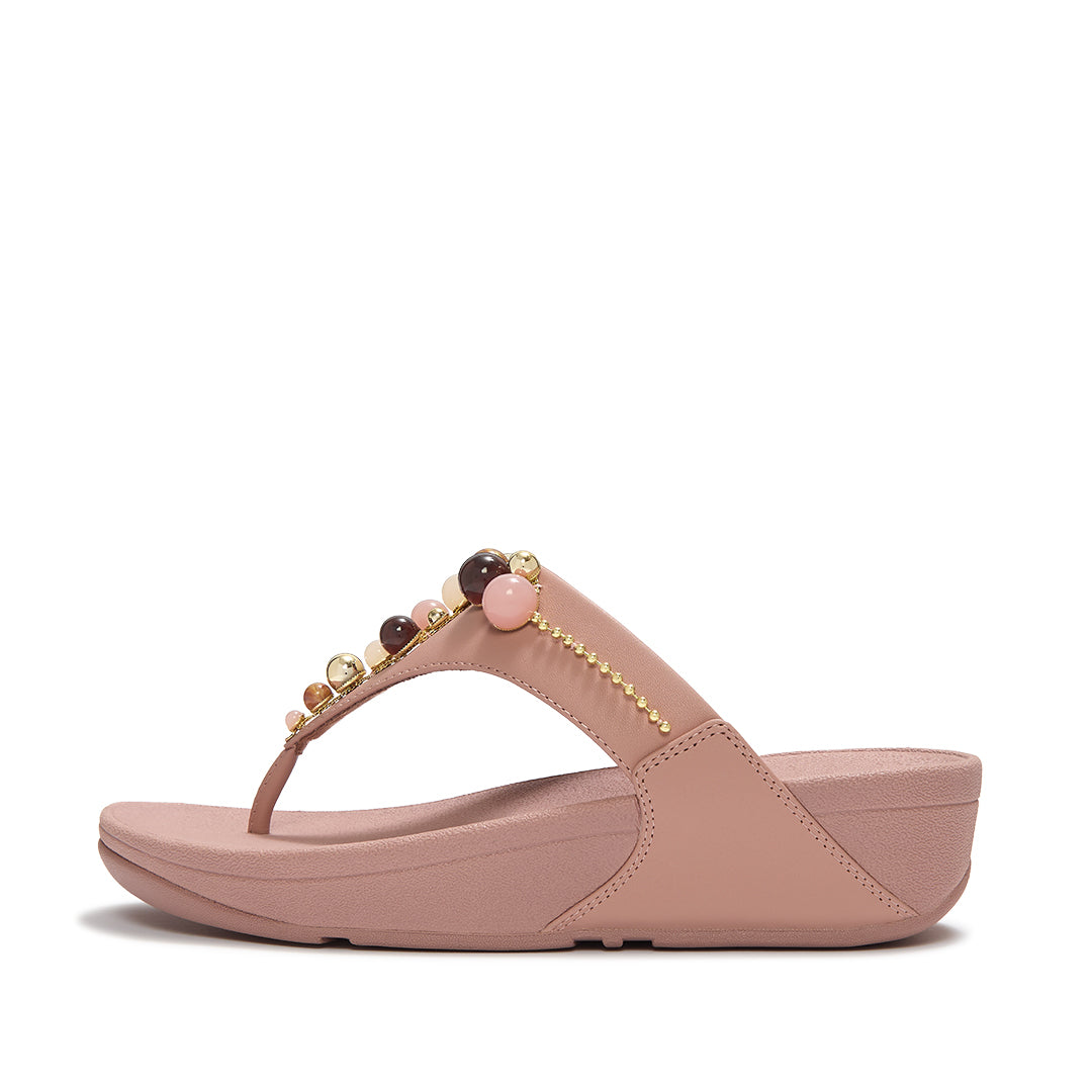FitFlop LULU Beaded Toe-Post Sandals featuring a triangular vamp, tonal bead embellishments and a cushioned Microwobbleboard™ sole.