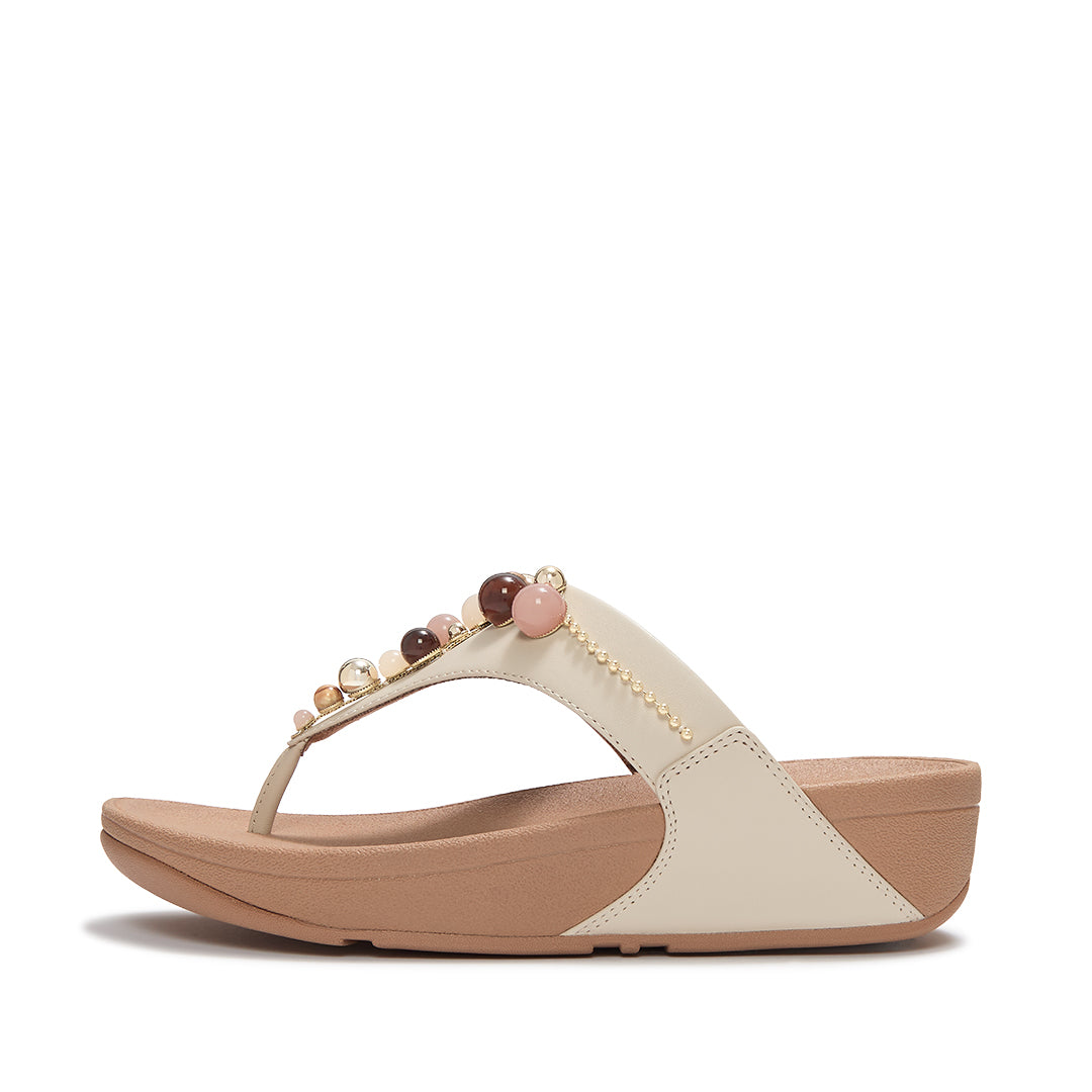 FitFlop LULU Beaded Toe-Post Sandals featuring a triangular vamp, tonal bead embellishments and a cushioned Microwobbleboard™ sole.