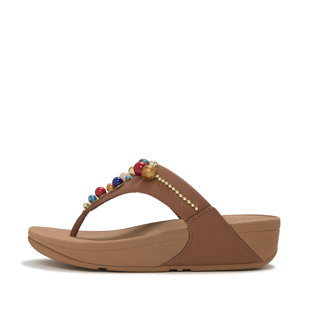FitFlop LULU Beaded Toe-Post Sandals featuring a triangular vamp, tonal bead embellishments and a cushioned Microwobbleboard™ sole.