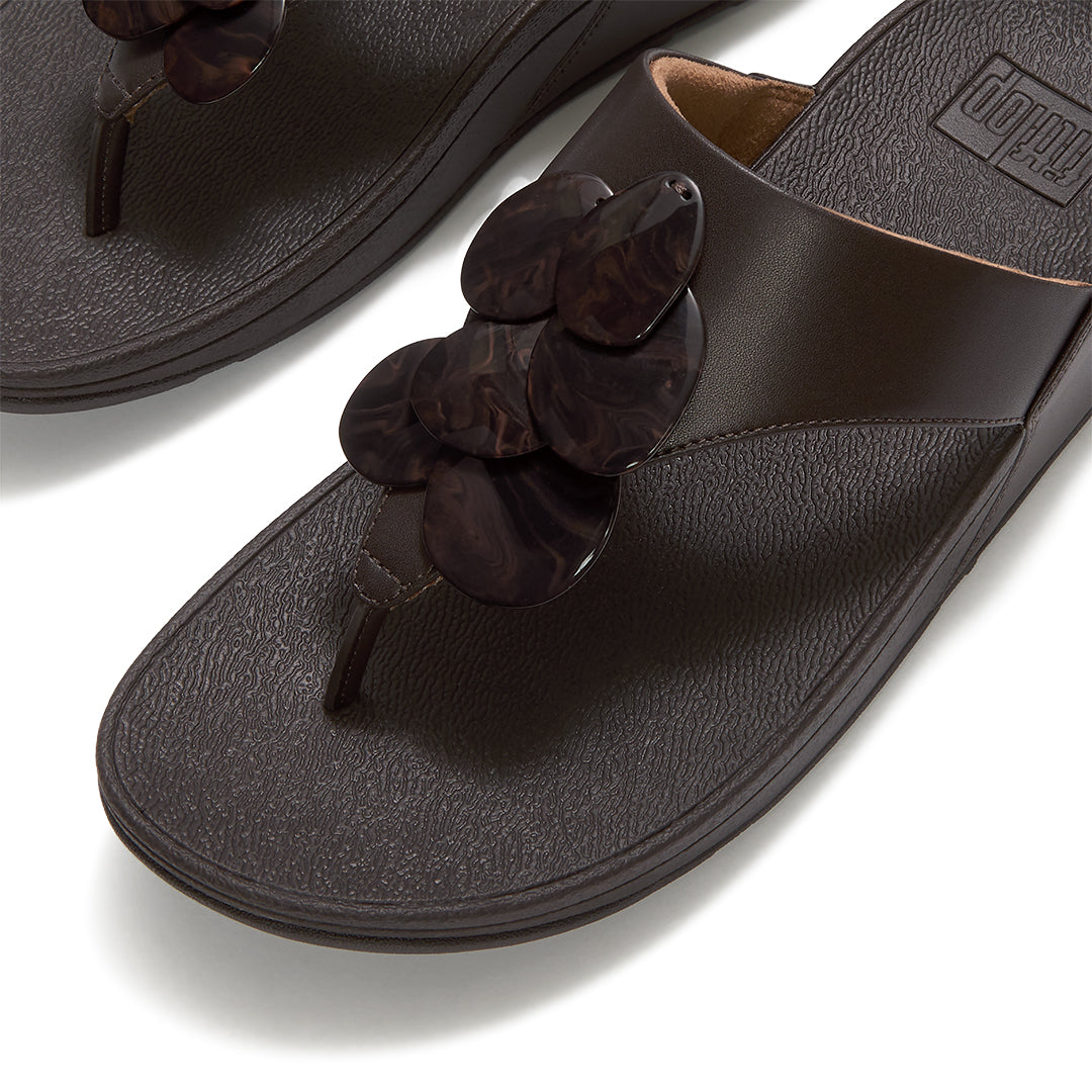 Close-up of FitFlop LULU Disc-Cluster Toe-Post Sandals showcasing the smooth, organically shaped marble-effect disc embellishments.