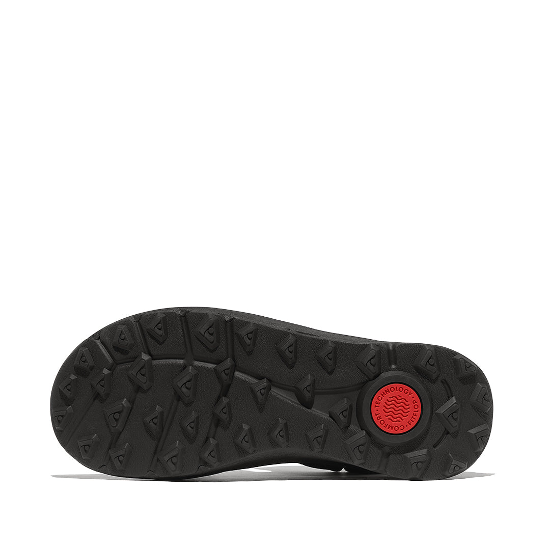 Outsole of FitFlop NEO-D-HYKER Outdoor Sandals featuring a triangular tread pattern for enhanced grip on trails, mud, and uneven surfaces.