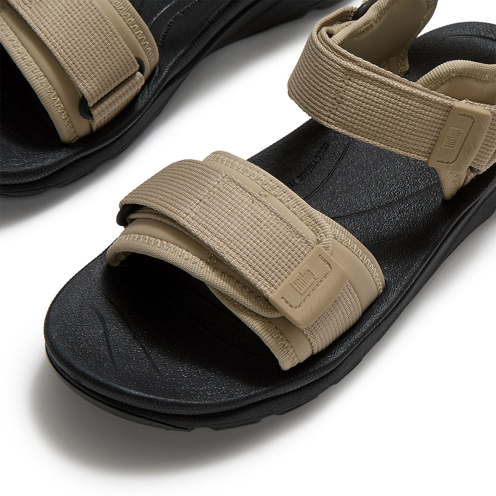 Close-up of FitFlop NEO-D-HYKER Outdoor Sandals featuring water-resistant webbing straps, TPU strap ends, and secure fastening system.