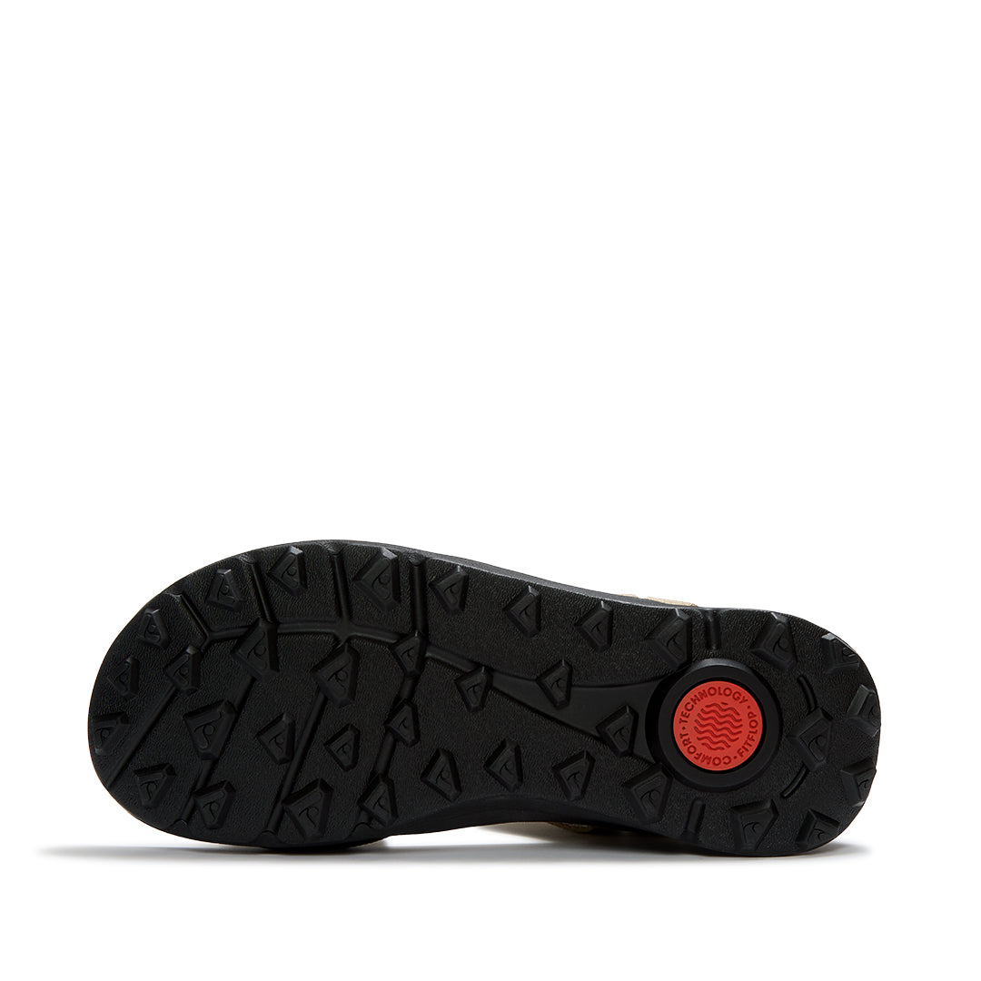 Outsole of FitFlop NEO-D-HYKER Outdoor Sandals featuring a triangular tread pattern for enhanced grip on trails, mud, and uneven surfaces.