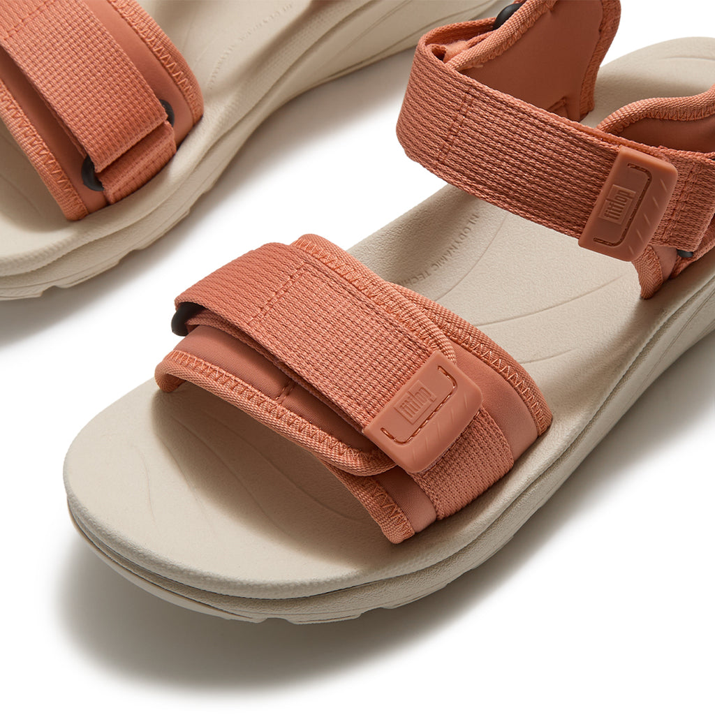 Close-up of FitFlop NEO-D-HYKER Outdoor Sandals featuring water-resistant webbing straps, TPU strap ends, and secure fastening system.