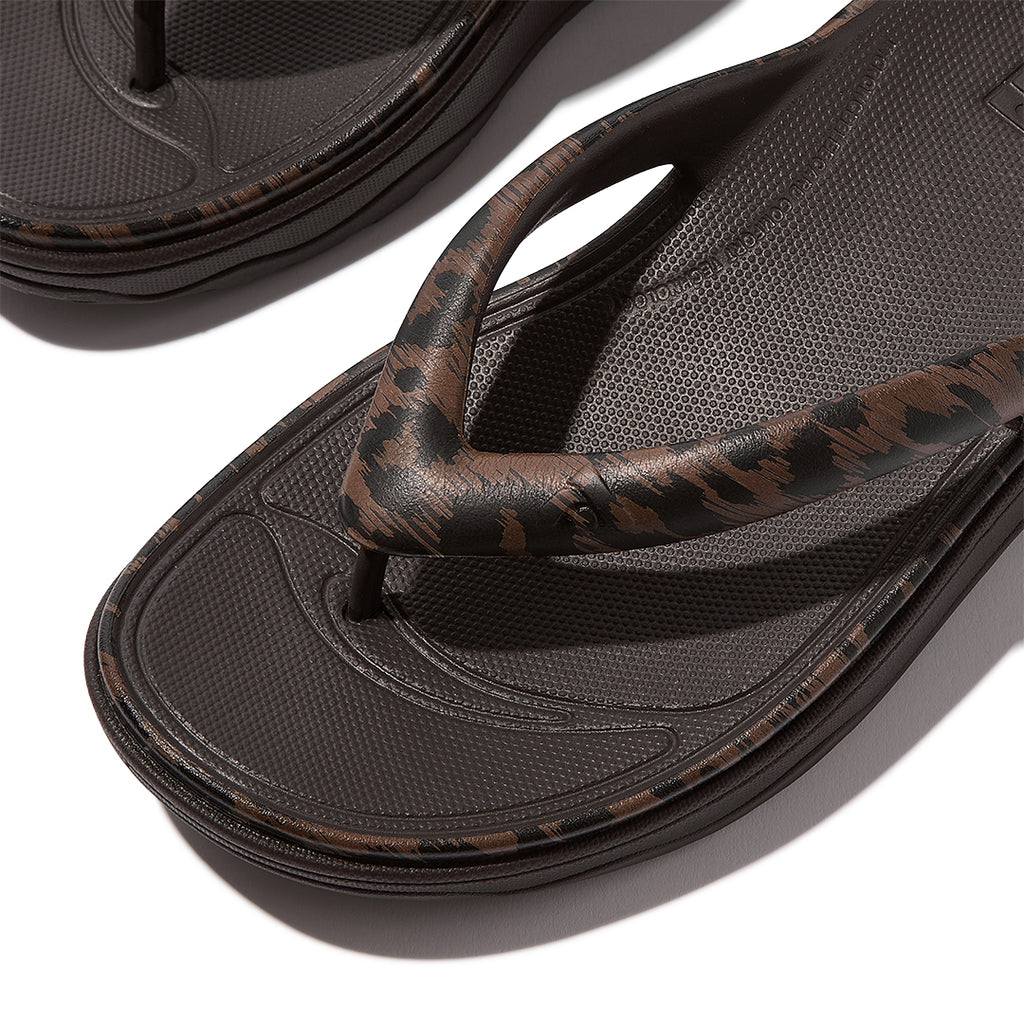 Close-up of FitFlop RELIEFF Leopard Recovery Toe-Post Sandals featuring soft EVA construction and all-over leopard-print detailing.