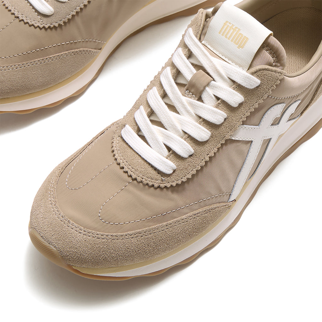 Close-up of FitFlop RETRO-Q FF Fabric/Suede Sneakers featuring premium suede detailing, lightweight nylon panels, and retro styling.