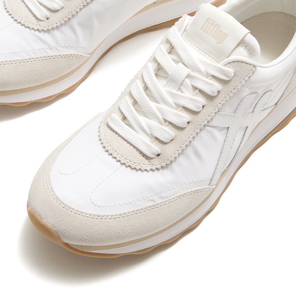 Close-up of FitFlop RETRO-Q FF Fabric/Suede Sneakers featuring premium suede detailing, lightweight nylon panels, and retro styling.
